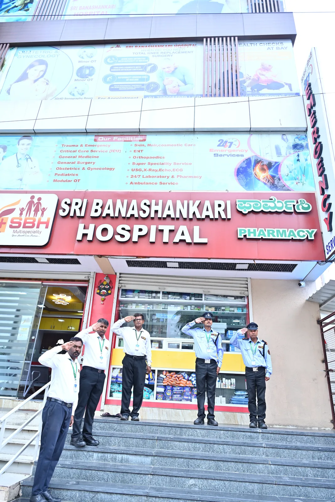 Poorvika FMS guards saluting outside a hospital site in Bengaluru